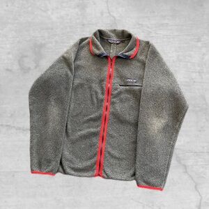 Vintage Patagonia Synchilla fleece jacket in gray with red piping. Made in USA.